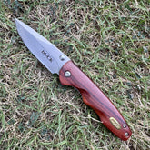 Buck Folding Knife – Hard Steel Blade with Wooden Handle | Classic Pocket Knife